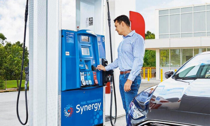 Man as Esso Mobil pump