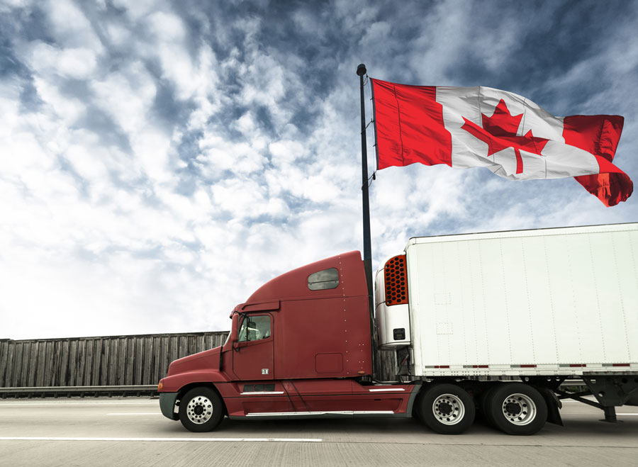 A semi truck in Canada showcases the Canadian flag.